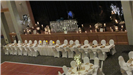 winter wedding reception view of the head table with white chairs and table cloth with beige napkins