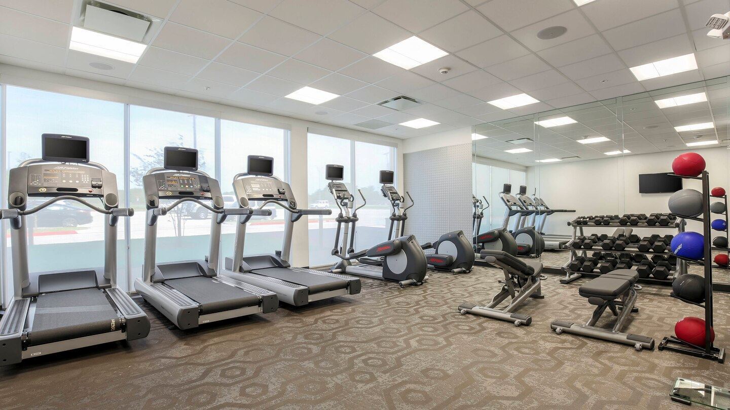 Fitness room with work out machines and weights
